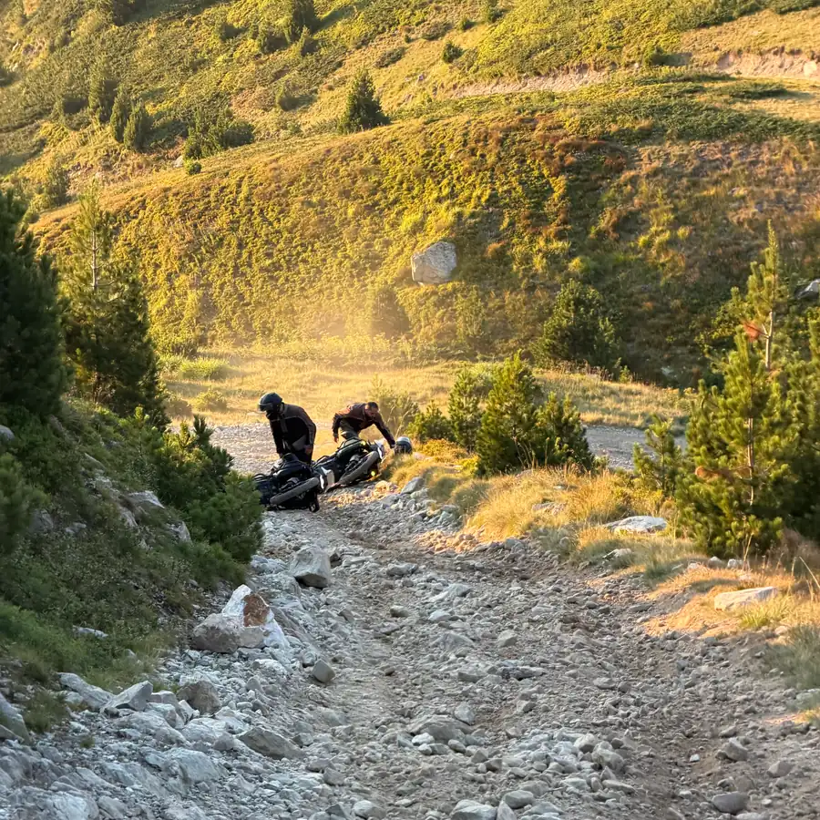 Rider descending a rutted rock section